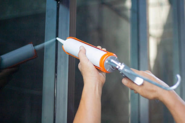 Glass façade showing structural glazing silicone on metal frames and weatherproof silicone on exterior joints
